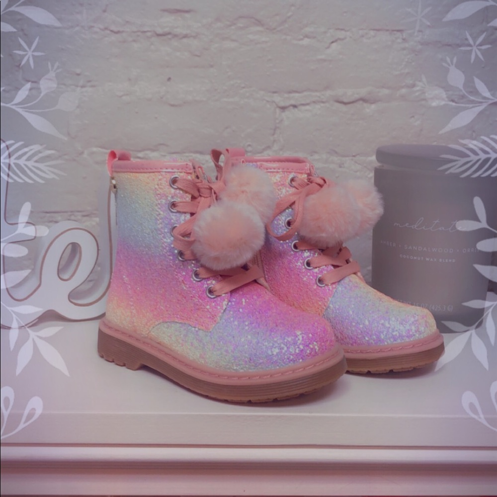 Adorable Nicole Miller sparkle boots with pom poms on the laces.